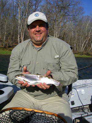 Fly fisher with rainbow trout on Tennessee’s Holston River