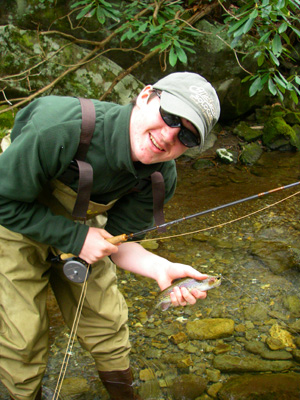 Fly fisher with Smoky mountain rainbow trout