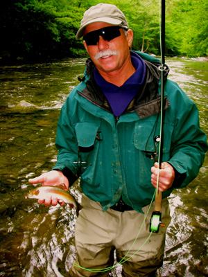 Fly fisher with Smoky mountain rainbow trout
