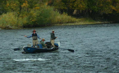 Peter Petruzzi and John Milner float with guide John McClure near Varney Bridge on the Madison